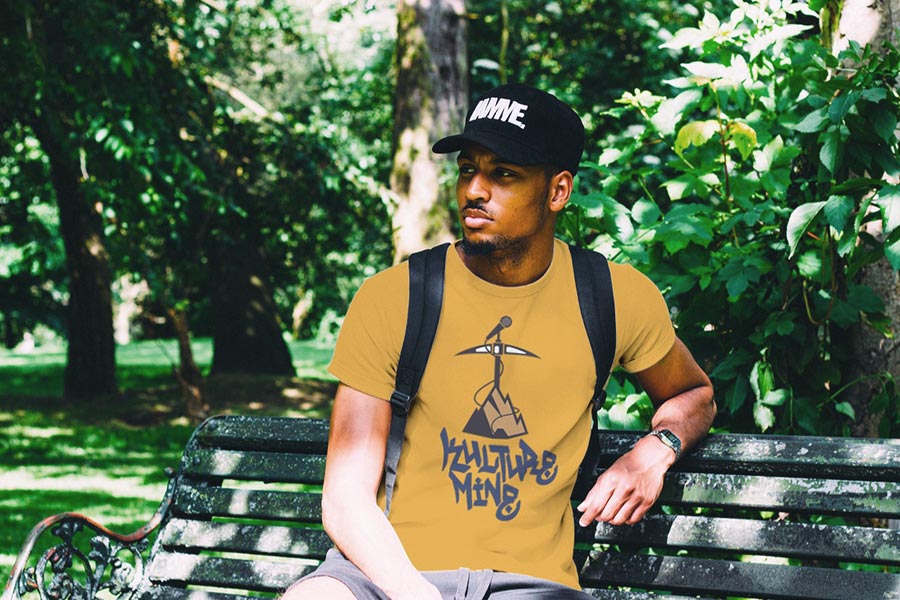 black man wearing t-shirt with graffiti style logo printed on it